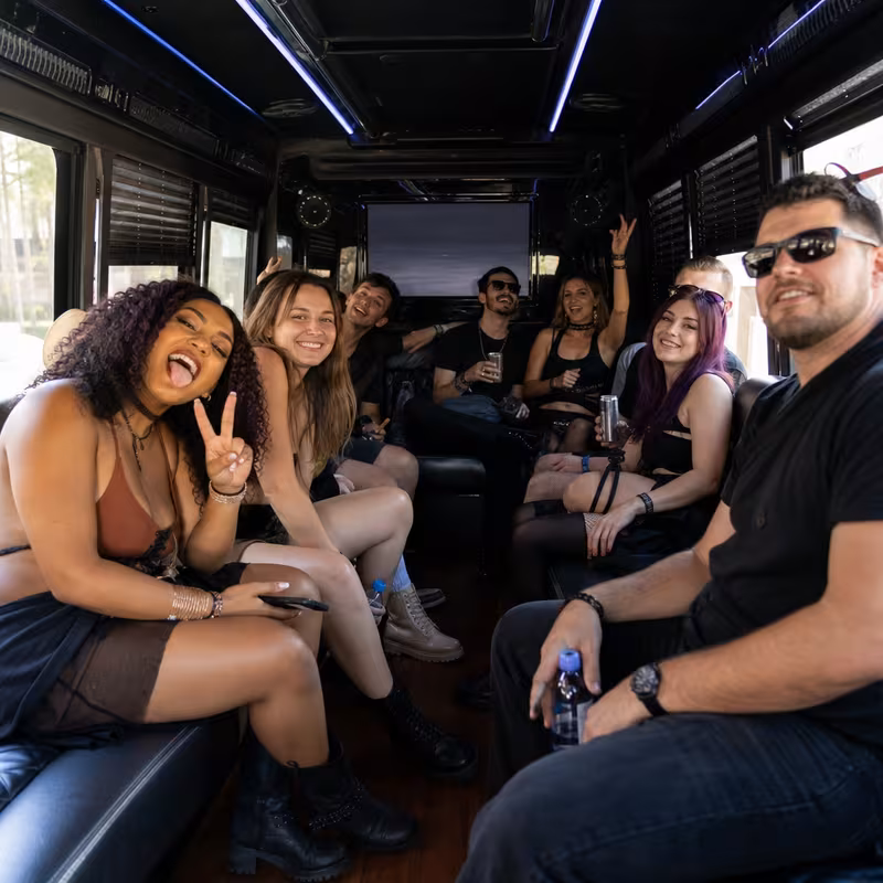 Passengers loading luggage while boarding an Huntington Beach group shuttle