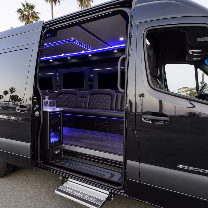 Party bus interior with wraparound leather seating and LED lighting in Huntington Beach