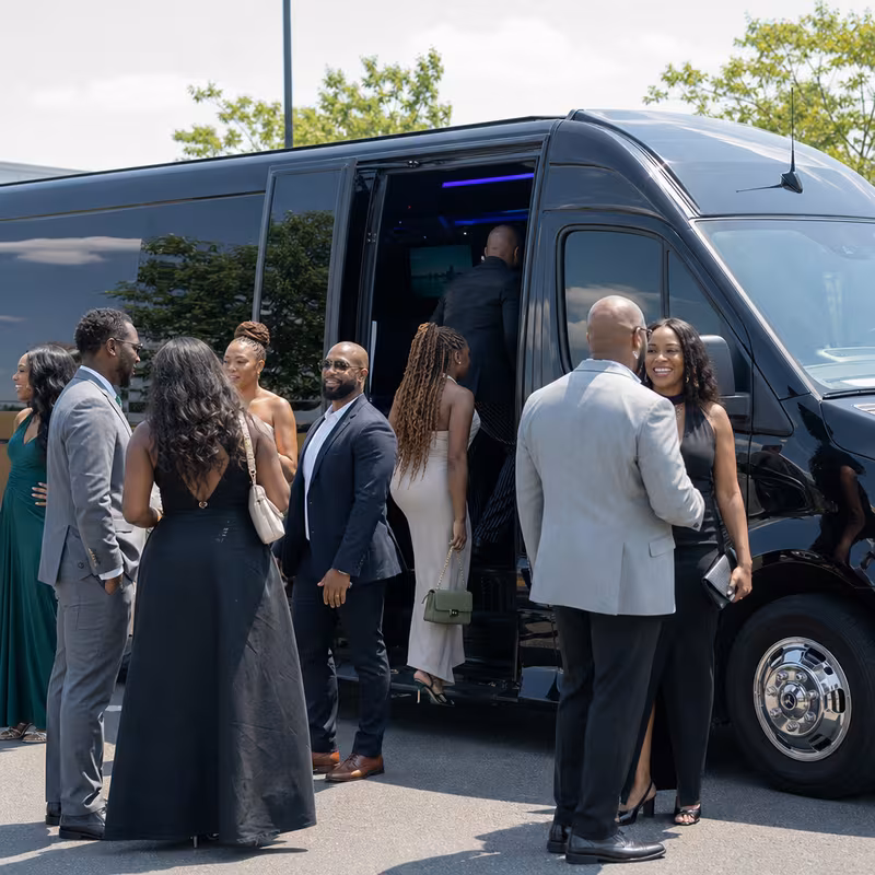 Passengers loading luggage while boarding an Huntington Beach group shuttle