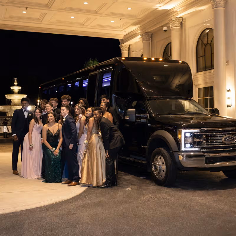 Party bus interior with wraparound leather seating and LED lighting in Huntington Beach