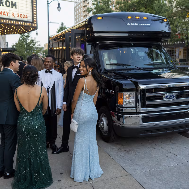 Passengers loading luggage while boarding an Huntington Beach group shuttle