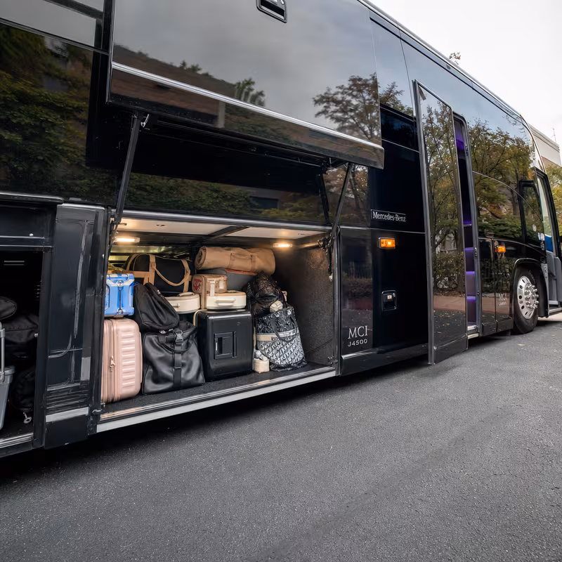 Party bus interior with wraparound leather seating and LED lighting in Huntington Beach