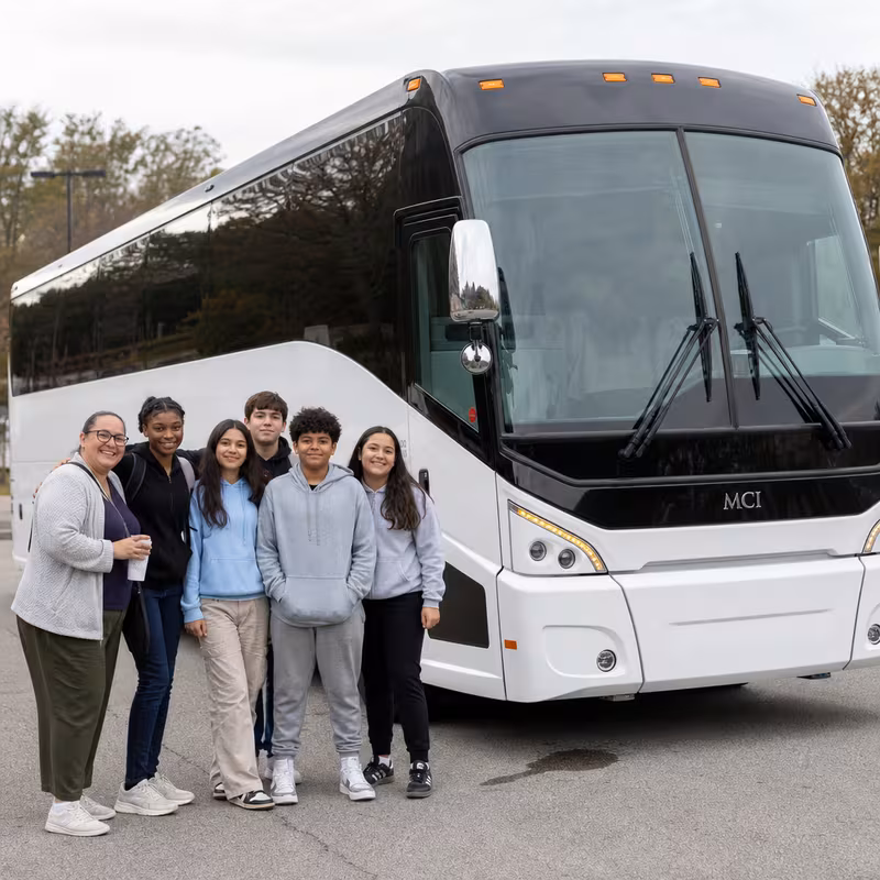 Passengers loading luggage while boarding an Huntington Beach group shuttle