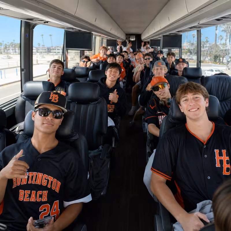 Black Mercedes Sprinter van staged for an Huntington Beach Sporting Event Transportation group