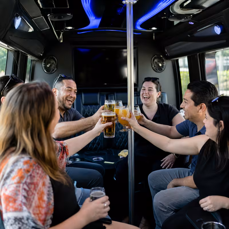Group boarding a white charter bus for Winery & Brewery Tour Transportation transportation in Huntington Beach